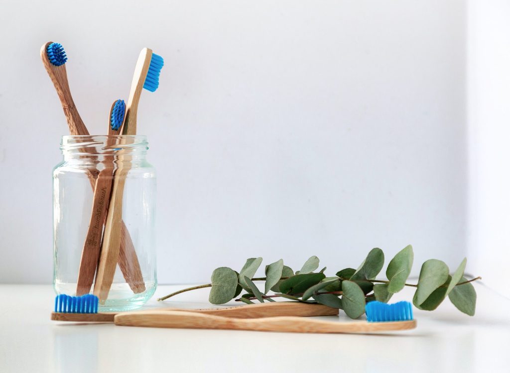tooth brushes in a transparent bottle